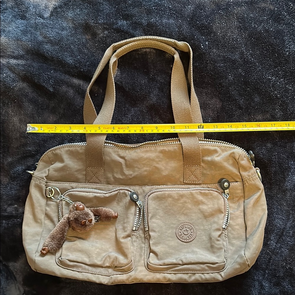 Dark tan Kipling bag with monkey charm